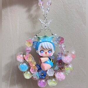 Buy 1 get 1 free🎁Luminous flower ball with Cute Doll Pendant